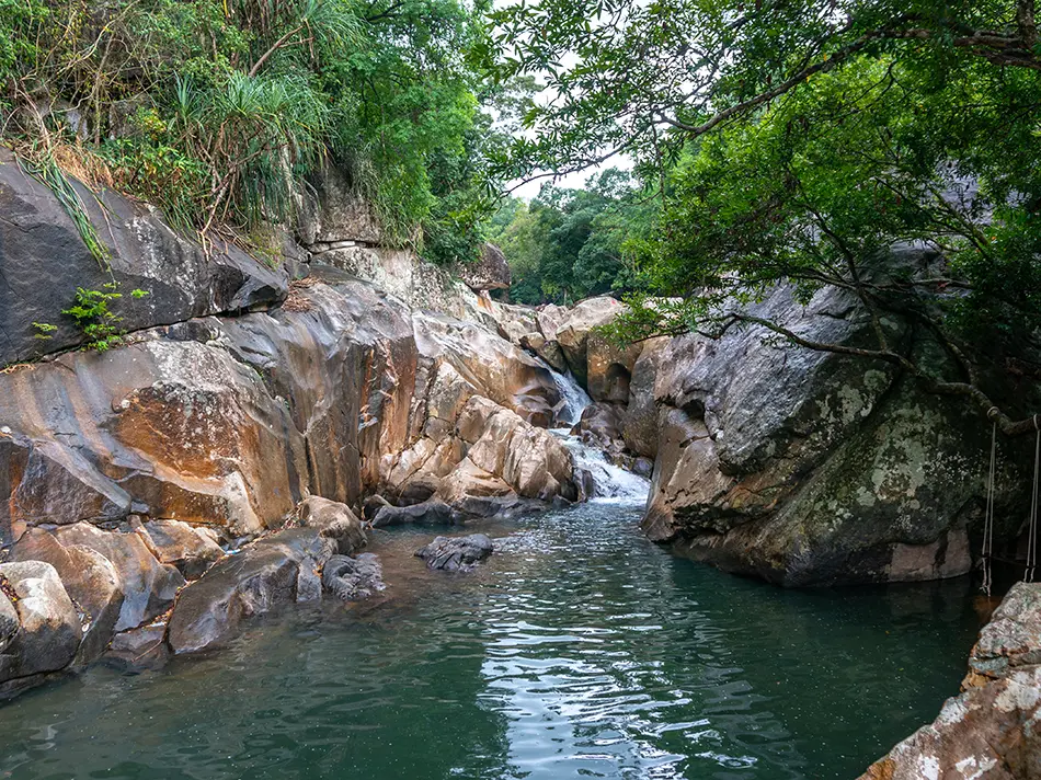 Ba Ho Waterfall hidden in the jungle near Nha Trang, flowing through rocky pools perfect for hiking and swimming