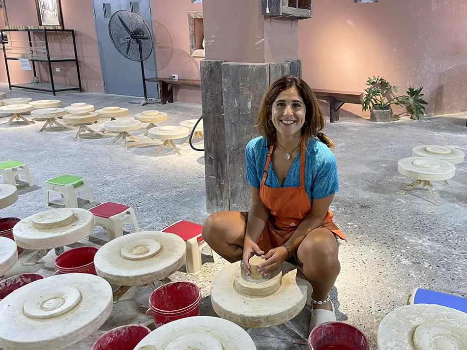 Traveler learning pottery at Bat Trang Museum, a cultural hidden gem near Hanoi celebrating local craft