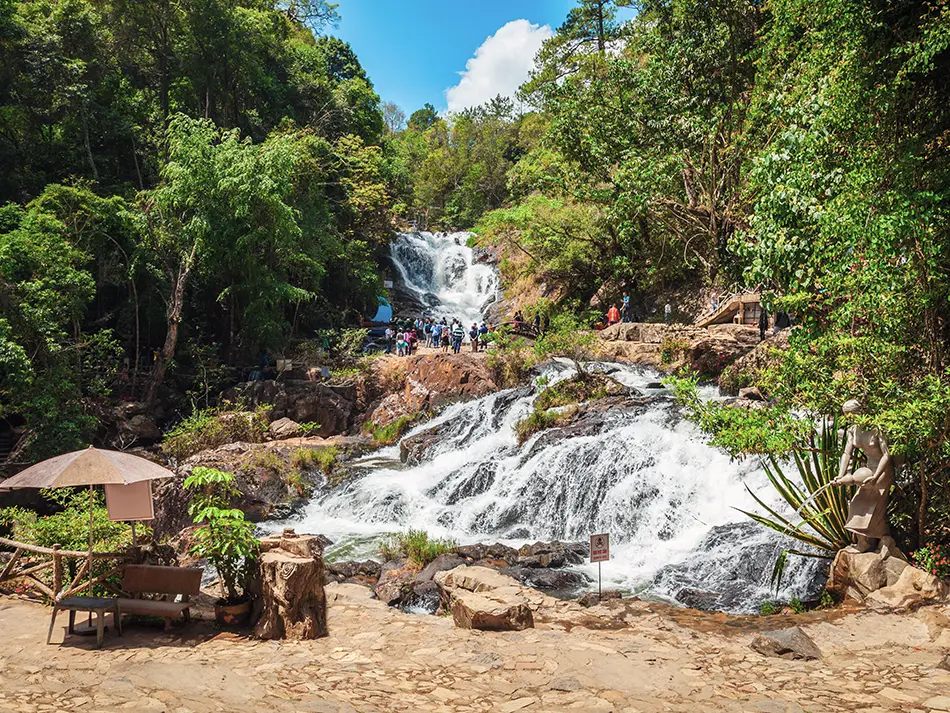 Datanla Waterfall rushing down forested rocks near Da Lat, a popular stop for adventure tourism in Vietnam