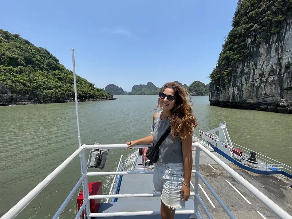 Ferry crossing between limestone islands in Northern Vietnam – great example of how to get around Vietnam by boat.