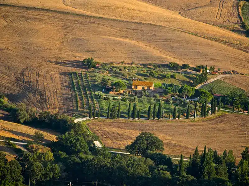 Panoramic view of a Tuscan farm, a classic green travel destination