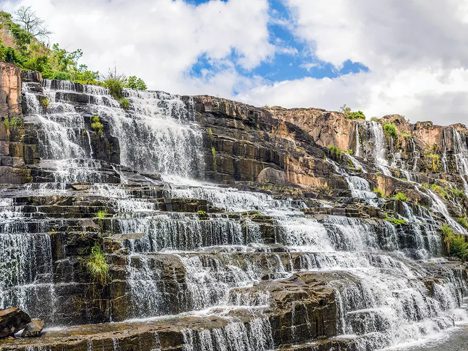 Pongour Waterfall spreading across wide rock terraces, a scenic highlight near Da Lat