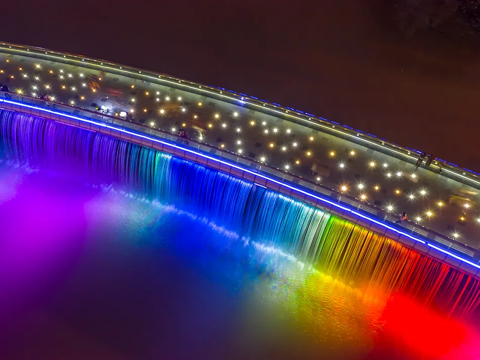 Aerial night view of the illuminated Starlight Bridge in Saigon, Vietnam