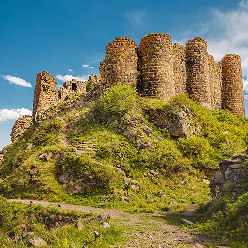 Ruins of Amberd Fortress perched on a hill near Mount Aragats, showcasing medieval Armenian defense architecture