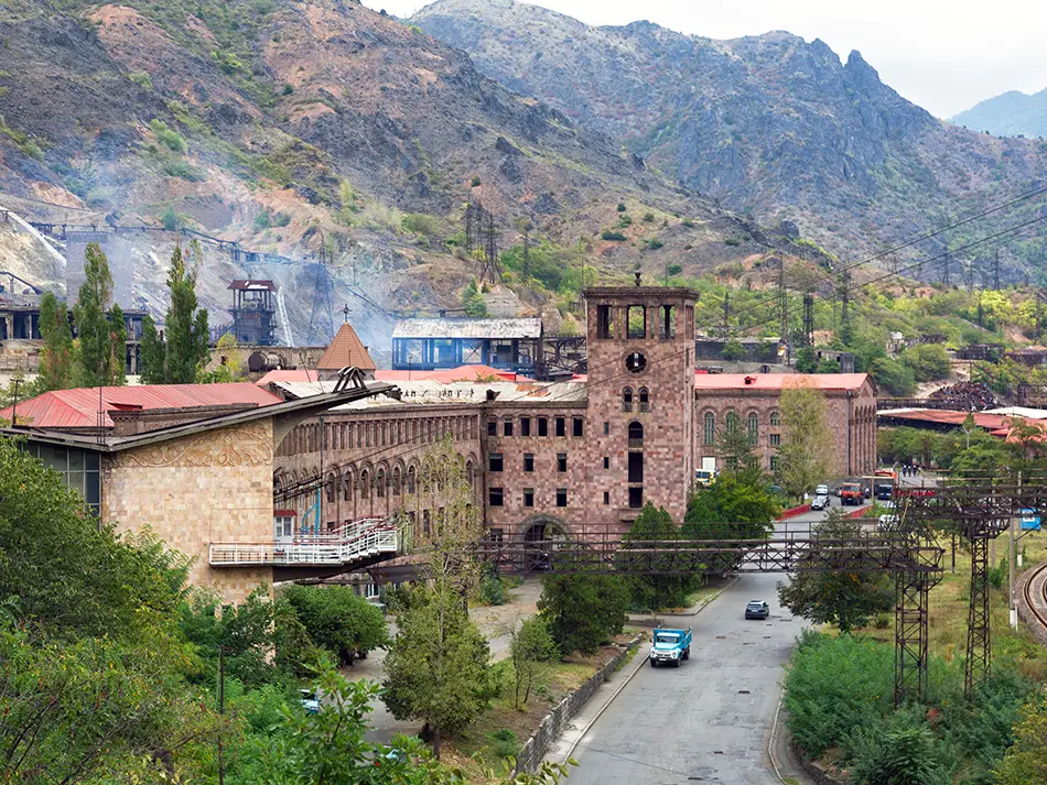 Central Alaverdi with copper plant and mountain backdrop, blending industrial and natural landscapes