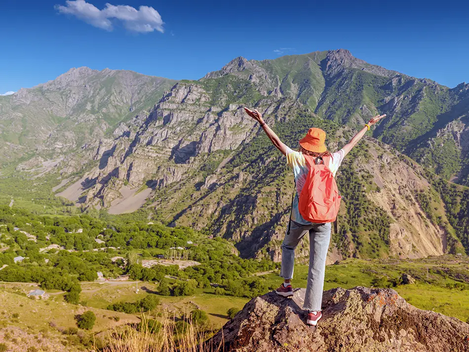 Solo hiker overlooking a mountain valley in Armenia
