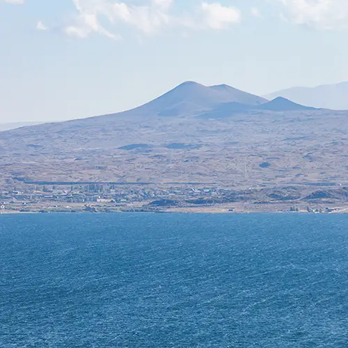 Panoramic view of Lake Sevan with distant mountains, a favorite destination for nature lovers