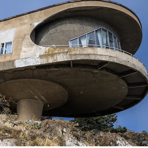 Abandoned Soviet-era spaceship café overlooking Lake Sevan, a striking example of retro-futurist architecture