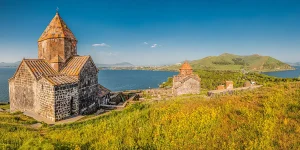 Stone Sevanavank monastery above Lake Sevan at golden sunrise, on of the best things to do in Sevan.