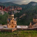 Noravank Monastery beneath crimson cliffs near Areni at sunset, one of the best things to do in Areni.