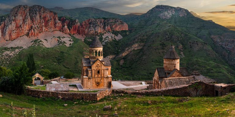Noravank Monastery beneath crimson cliffs near Areni at sunset, one of the best things to do in Areni.