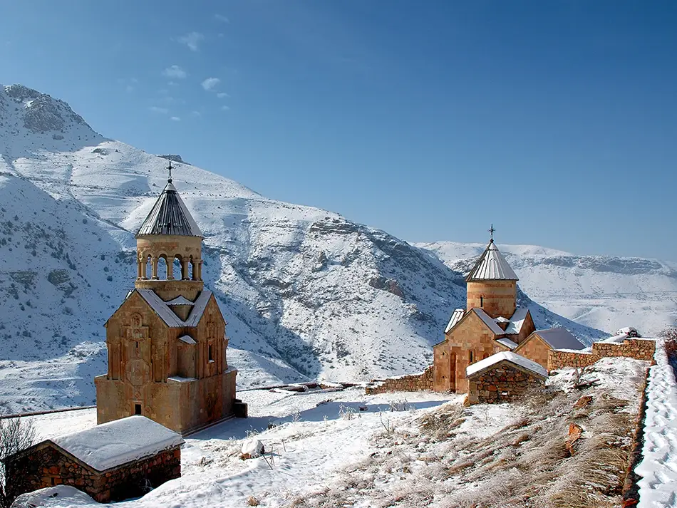 Snow-dusted Noravank Monastery with white peaks beyond questioning the best time to visit Areni