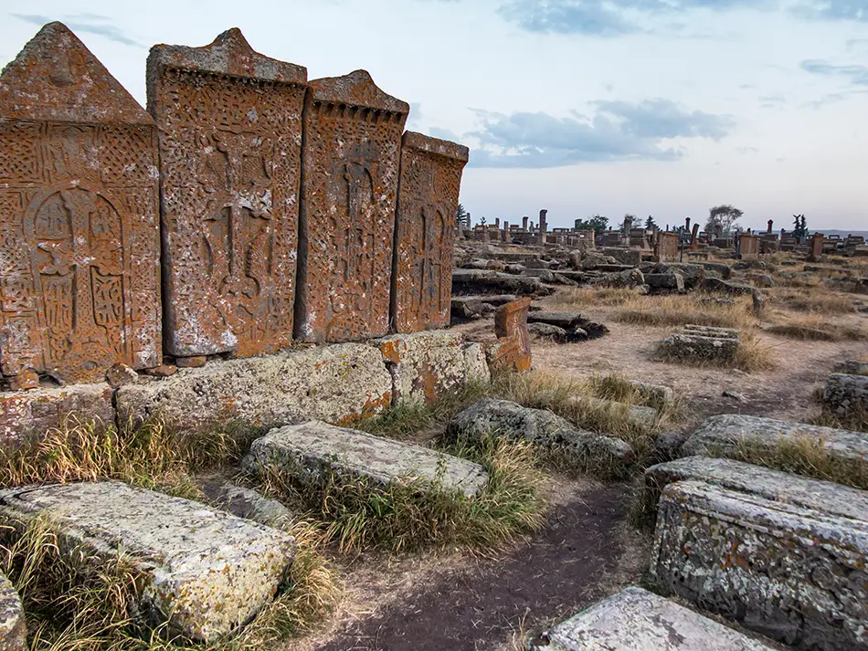 Medieval khachkars scattered across Noratus cemetery.