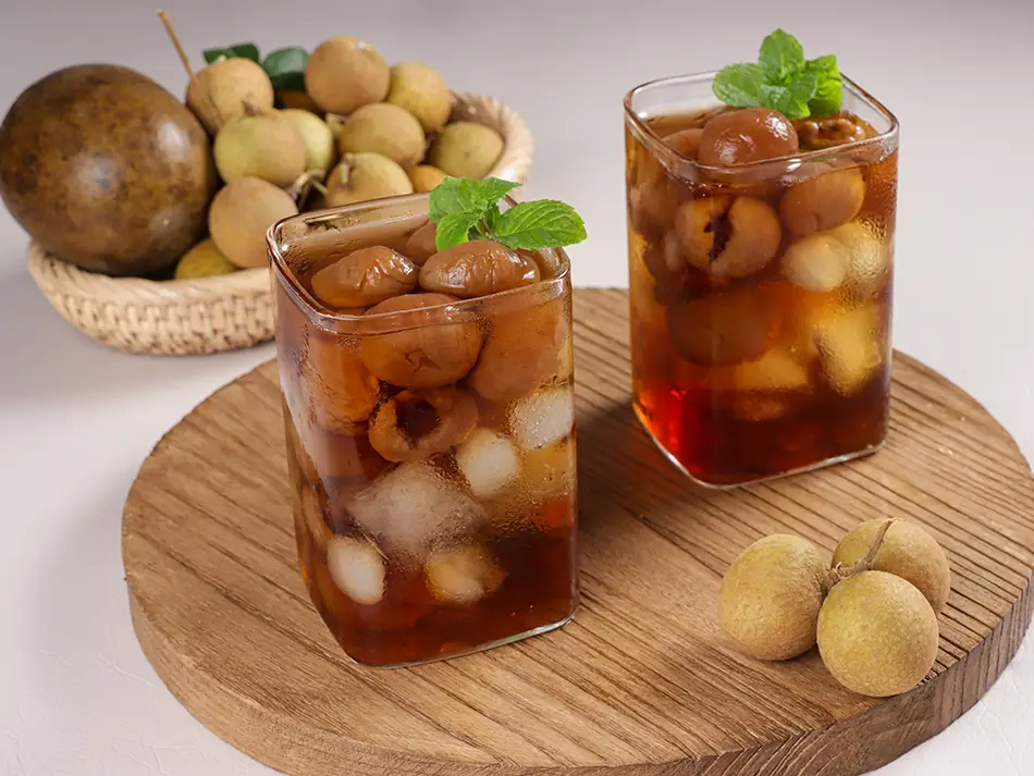 Glass of air mata kucing with longan and winter melon.