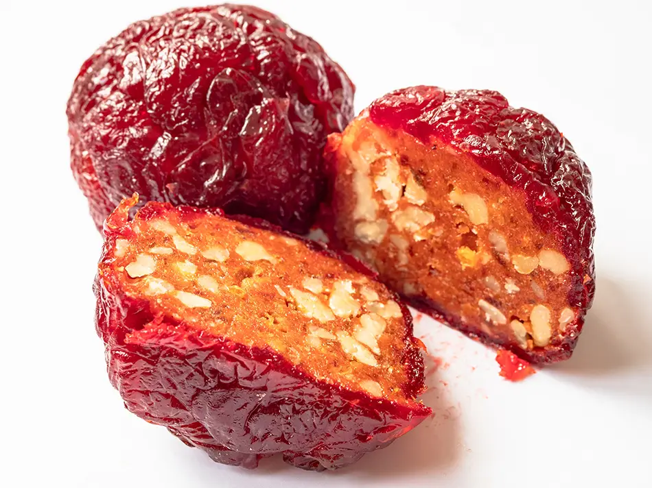 Armenian alani dessert made from dried peaches stuffed with walnuts, a traditional sweet from Armenia