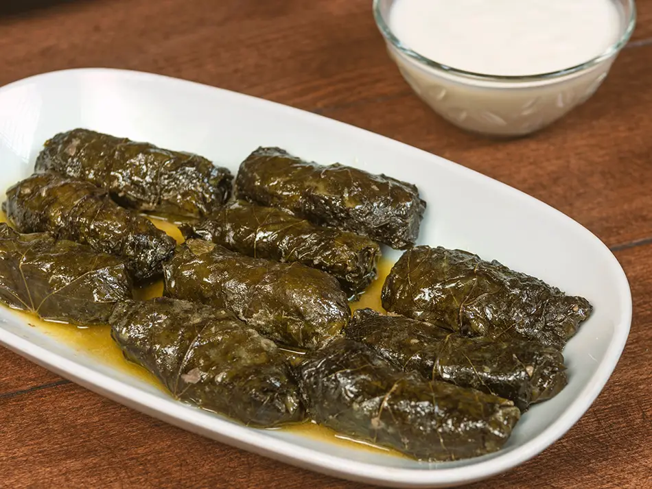 Grape leaves stuffed with rice and herbs, classic dolma from Armenian cuisine.