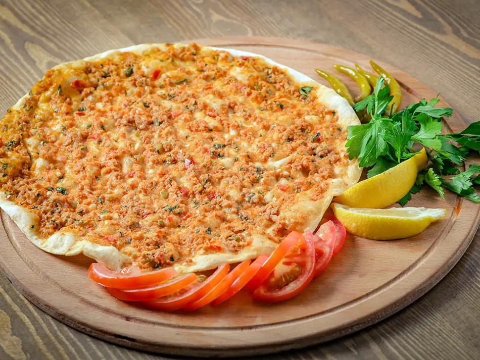 Crisp Armenian lahmajoum topped with minced meat and spices, best street food to try in Armenia.
