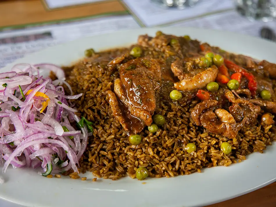 Rice with seared duck in Lambayeque, celebrated as part of the best food in Peru.