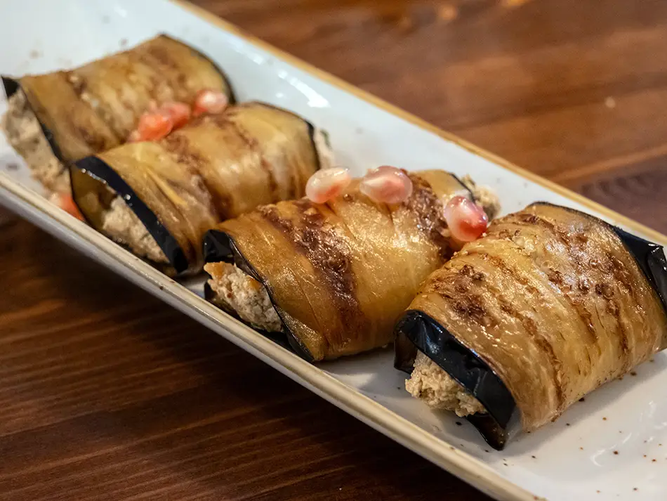 Local food in Georgia: badrijani nigvzit eggplant rolls filled with walnut-garlic paste.