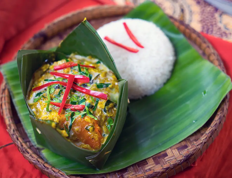 Amok Trey, steamed fish curry in banana leaf, a signature Cambodian dish among the best food in Cambodia