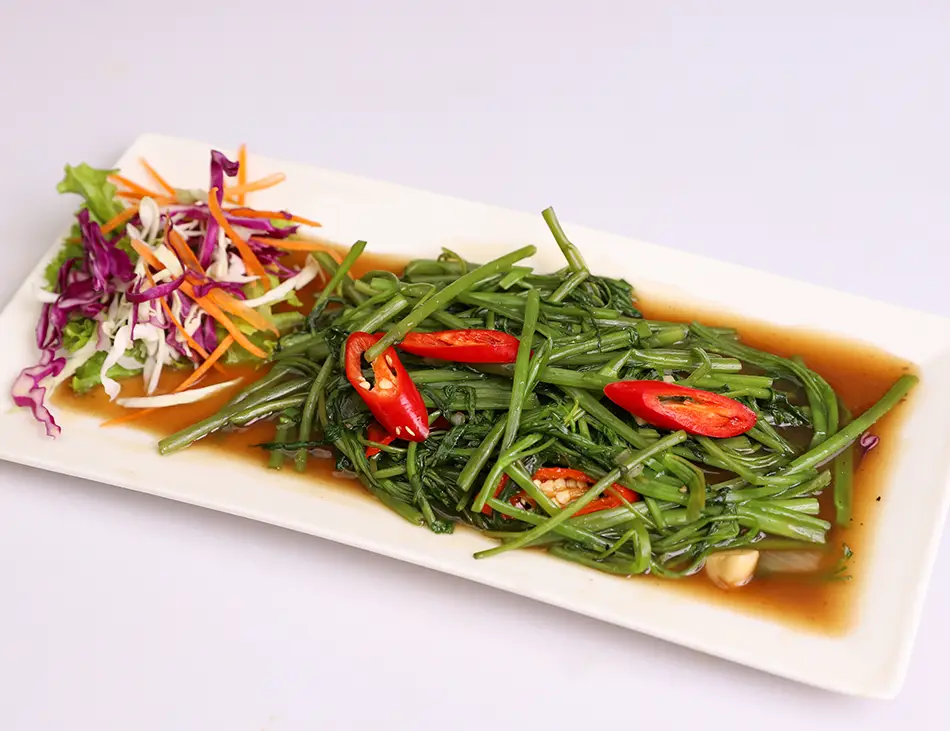 Cha Trakuon, stir-fried morning glory vegetable, a popular Cambodian side dish and local street food