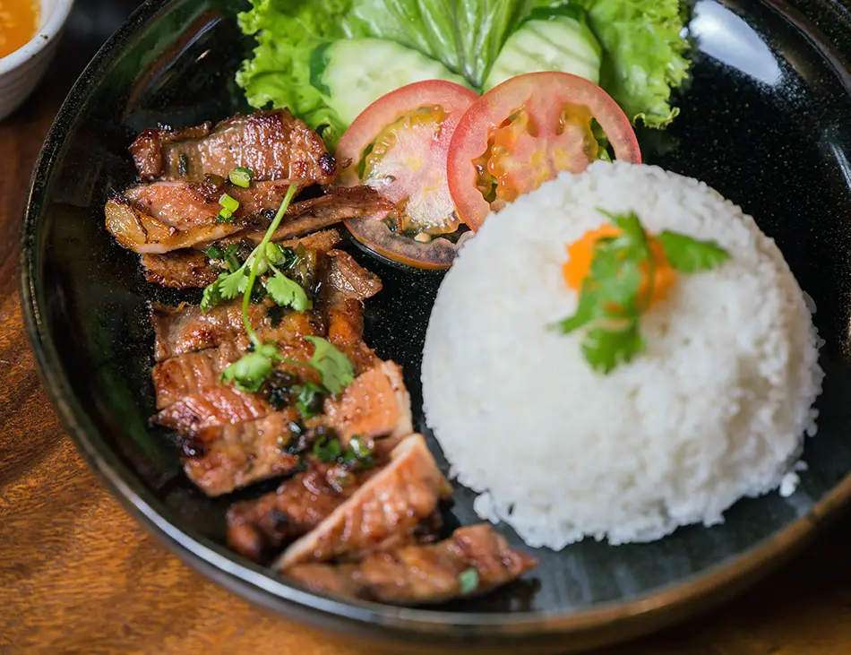 Bai Sach Chrouk, Cambodia’s famous grilled pork with rice, a popular breakfast and street food favorite in Cambodia