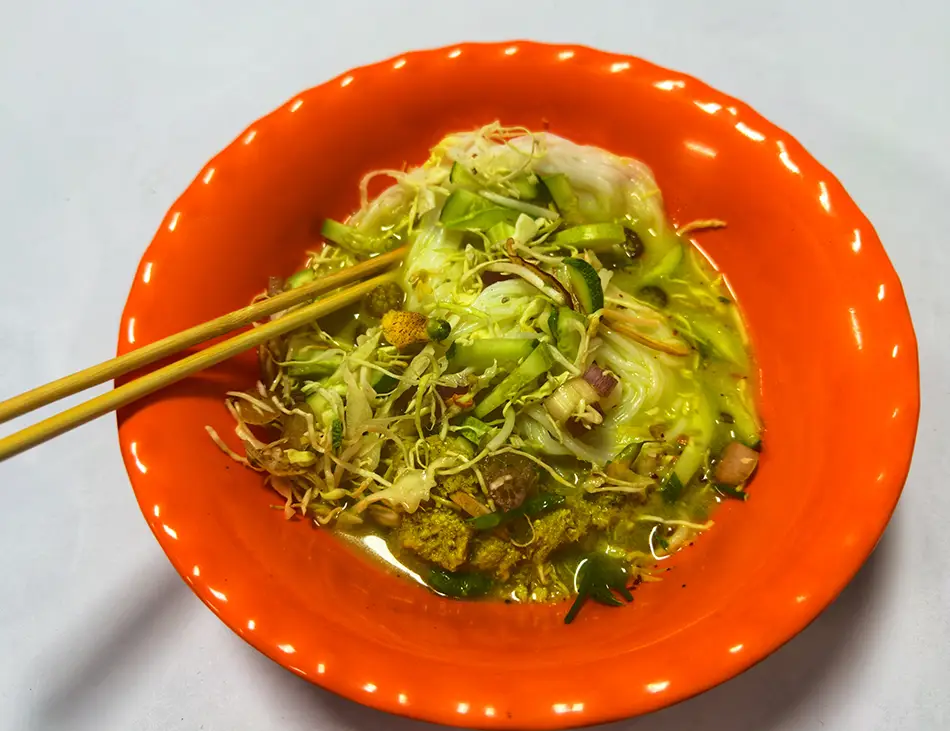 Nom Banh Chok, Cambodian rice noodles with green fish curry gravy, known as Khmer noodles