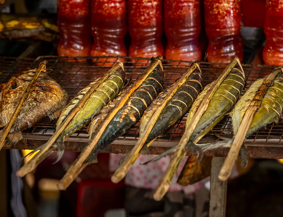 Trey Aing, grilled freshwater fish stuffed with herbs, a highlight of authentic Cambodian cuisine