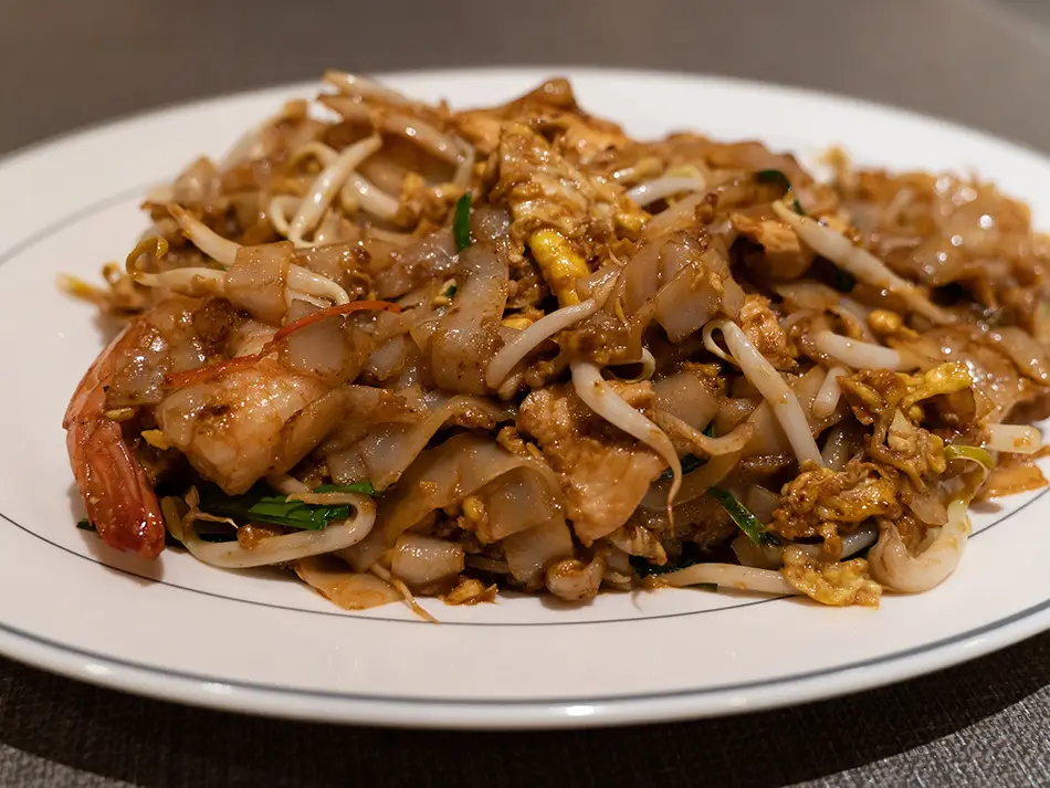 Smoky char kway teow noodles with prawns and bean sprouts, among the best dishes in Malaysia.