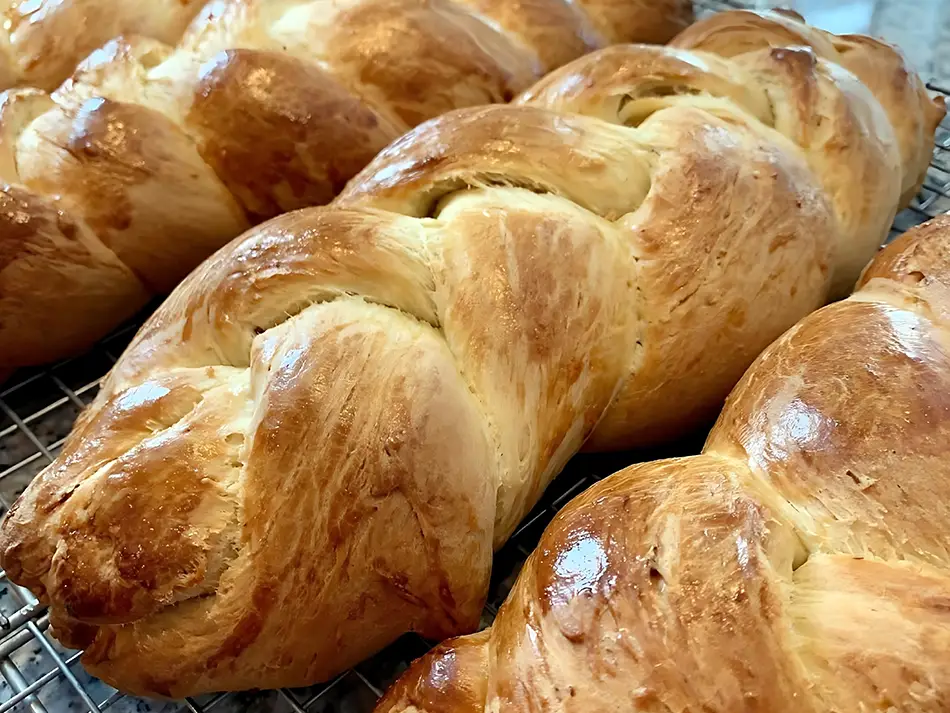 Freshly baked Armenian choereg bread, a traditional Easter pastry with a golden braided crust