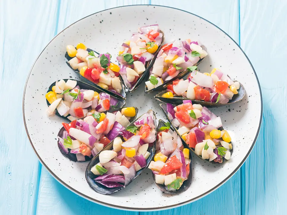  Mussels on the half shell topped with chalaca salsa in Callao — national dishes of Peru.