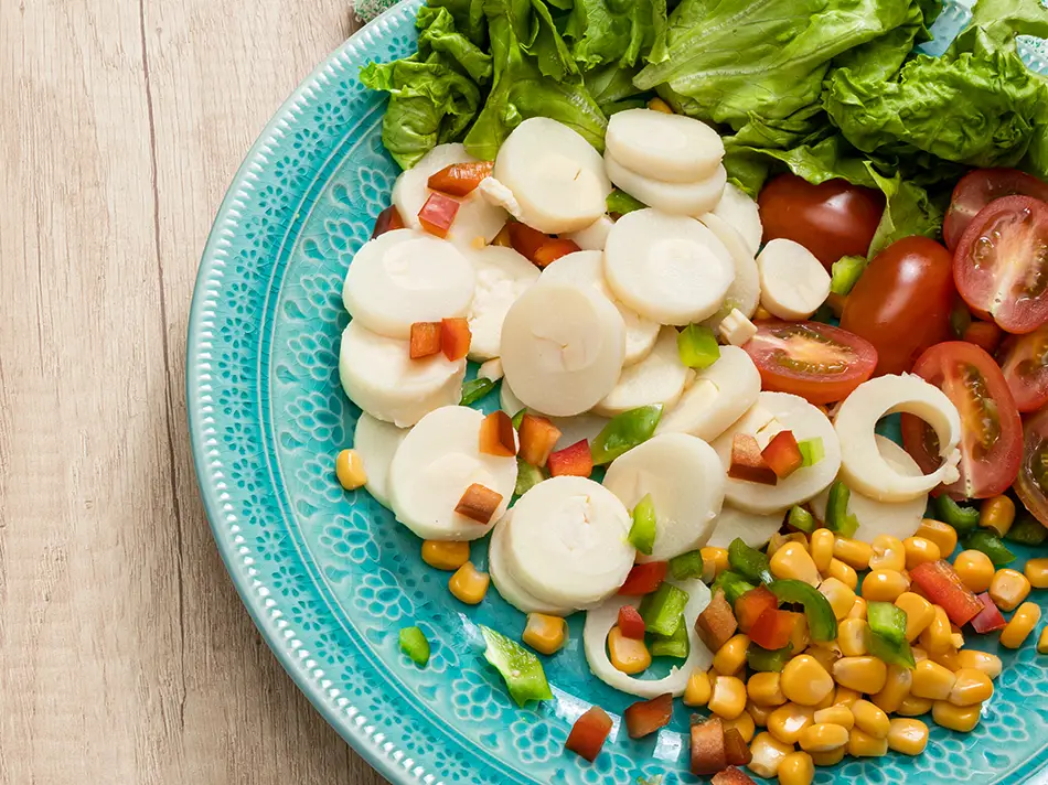 Palm-heart salad with lime and tomatoes from Iquitos — traditional Peru dishes.