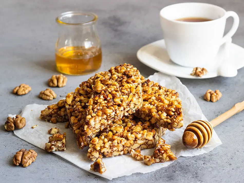 Gozinaki walnut brittle with honey, broken into diamond pieces.