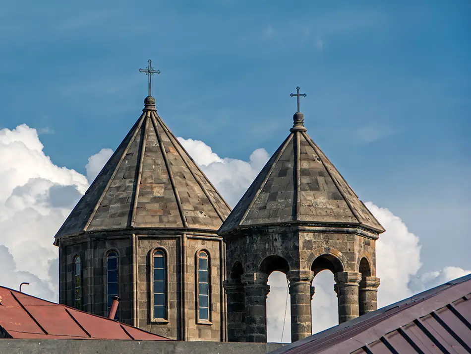 Stone domes and crosses of an Armenian church, a classic view of Gyumri in Armenia.