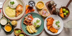 Best food in Peru: overhead flat lay of lomo saltado, pollo a la brasa and escabeche de pollo