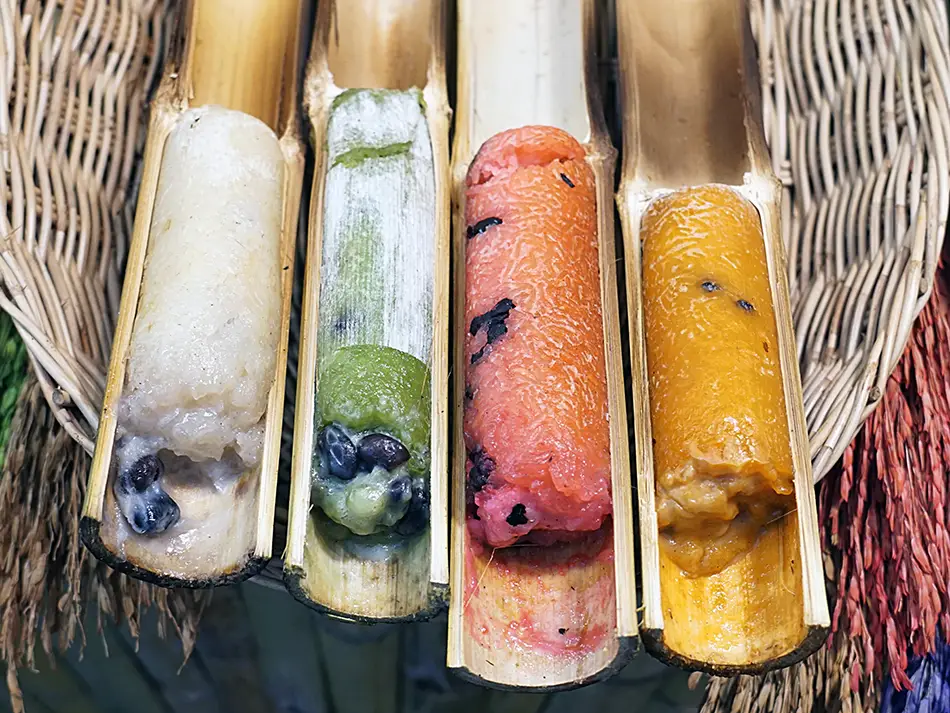 Best dessert in Laos: khao lam coconut sticky rice roasted inside bamboo tubes.
