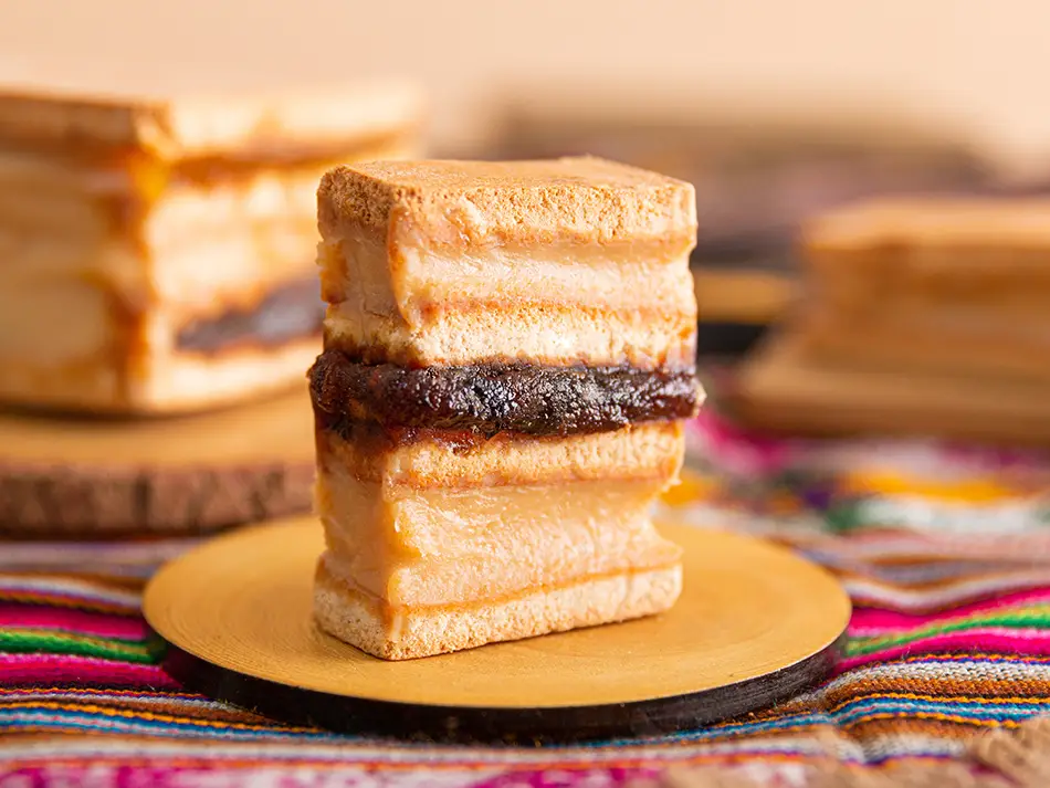 Lambayeque’s King Kong layered cookie with manjar blanco and pineapple jam — best dishes in Peru.