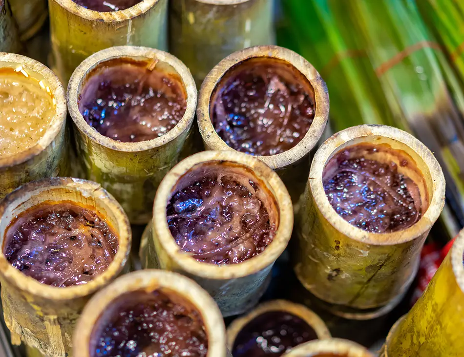 Kralan, Cambodian bamboo sticky rice with coconut and black beans, a traditional dessert in Cambodia cuisine