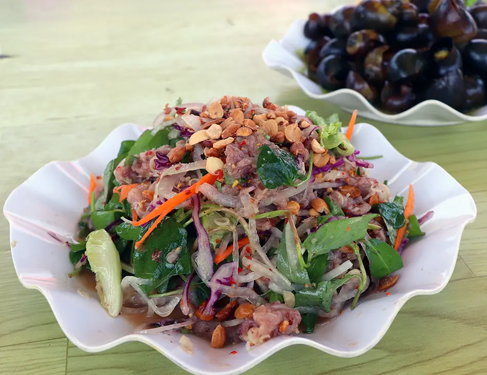 Lap Khmer, Cambodian beef salad with lime, herbs, and roasted rice, a refreshing best food in Cambodia pick