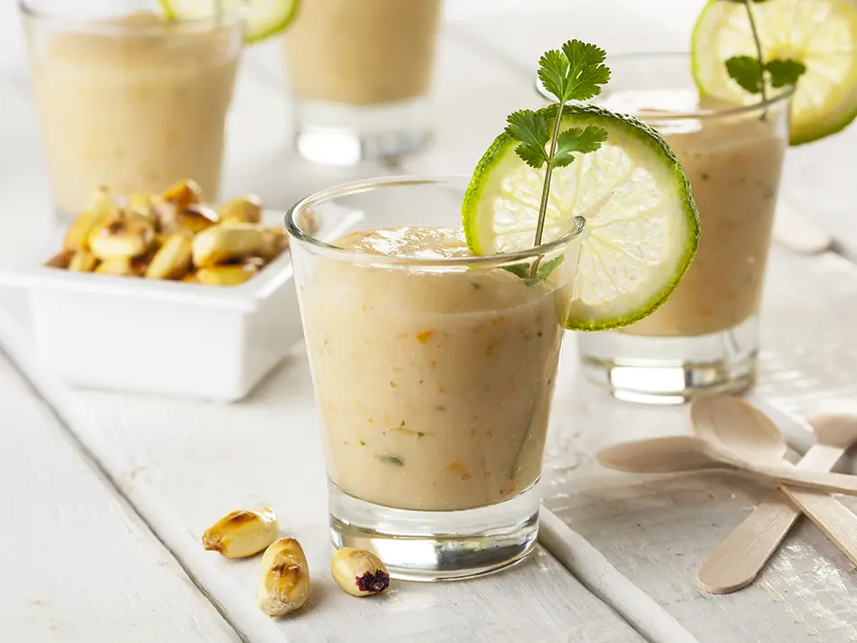Leche de tigre served chilled in a small glass in Lima — iconic Peruvian drink.