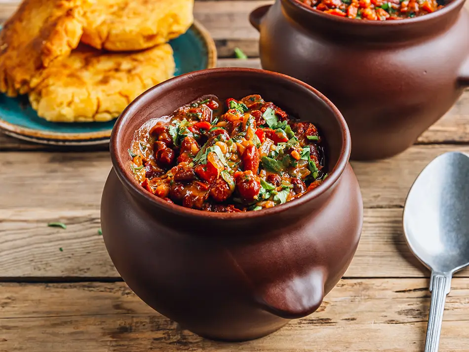 National dishes of Georgia: lobio qotanshi bean stew in a small clay pot.