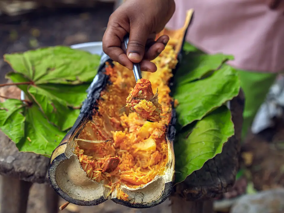 Manok pansuh - chicken cooked in bamboo with herbs, a smoky local Malaysian food.