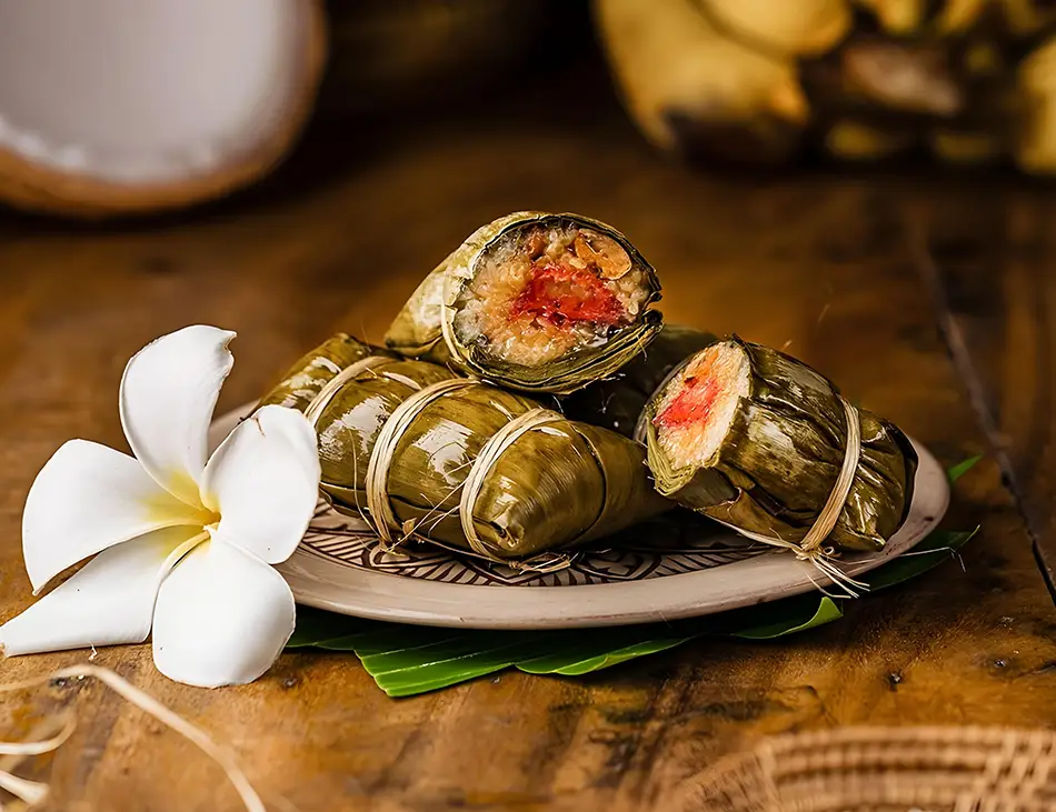 Nom Ansom Chrouk, Cambodian sticky rice cake with pork and mung bean, a festive Cambodian specialty