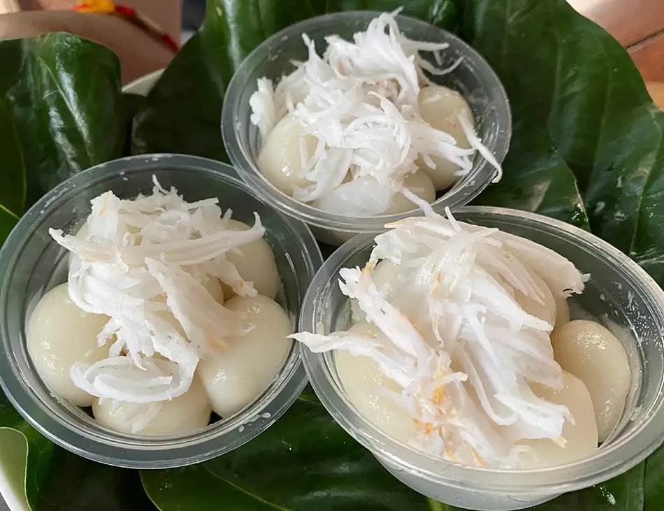 Num Plae Ai, sticky rice balls with palm sugar, a classic Cambodian dessert