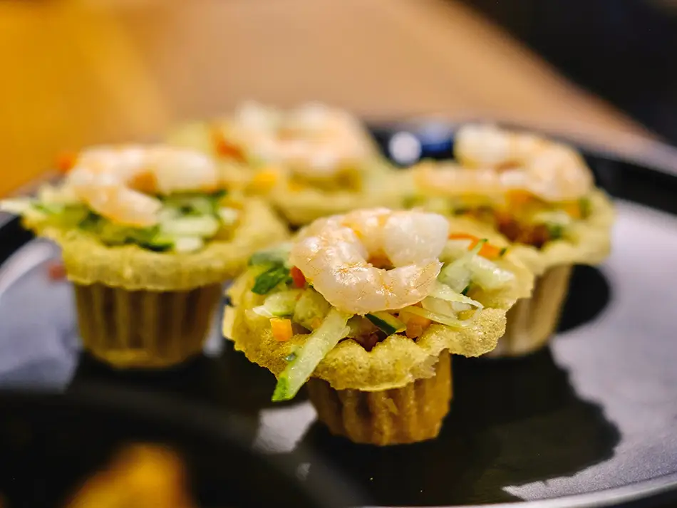 Crisp pai tee shells filled with prawns and vegetables, a festive local food in Malaysia.