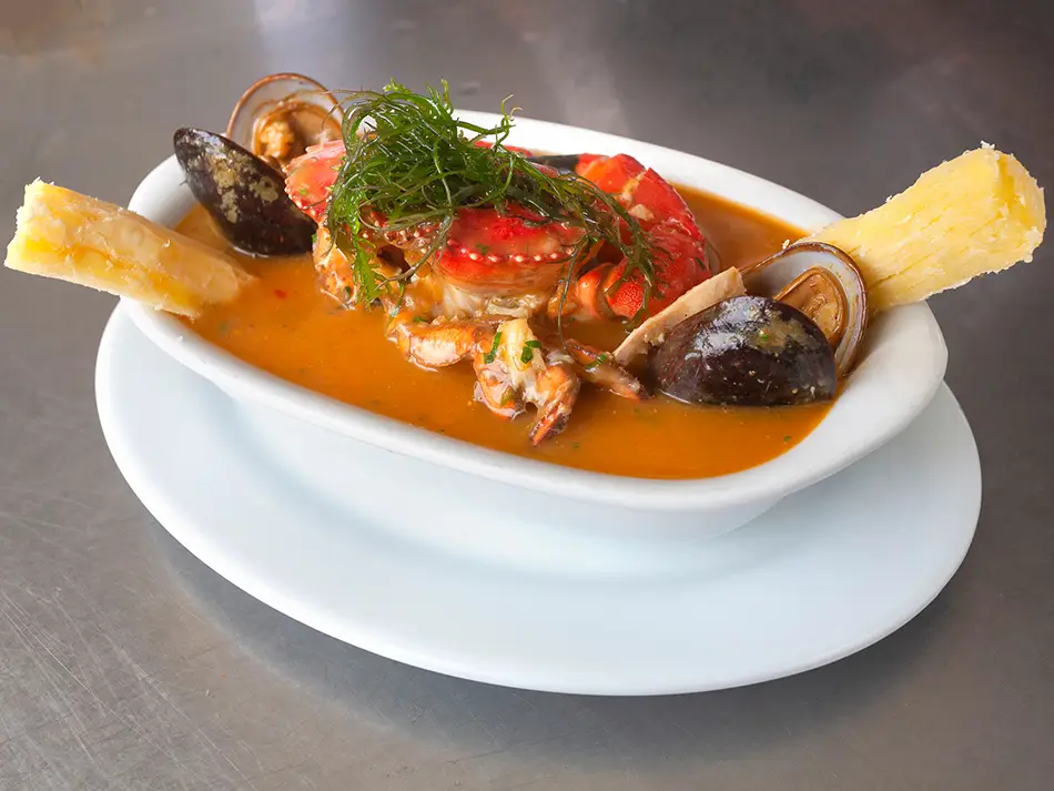 Parihuela seafood soup from Callao shows what to eat in Peru with crab, mussels and fish.