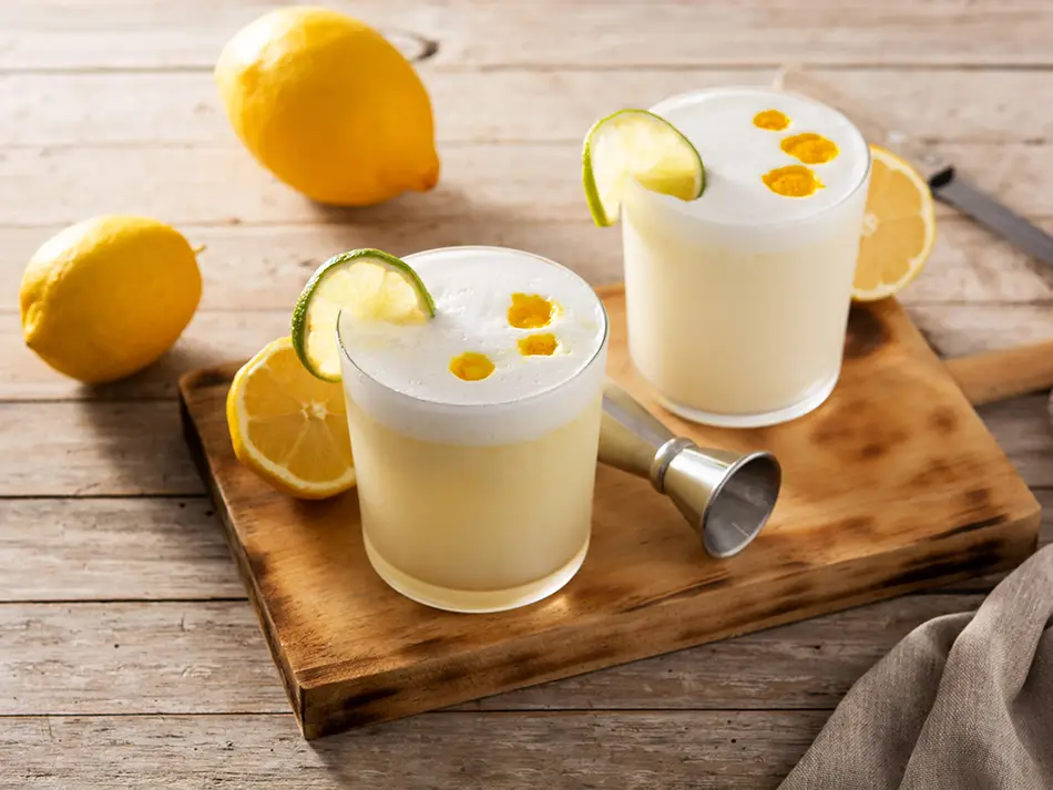 Best cocktails in Peru: classic pisco sour with foamy egg white and bitters in Lima.