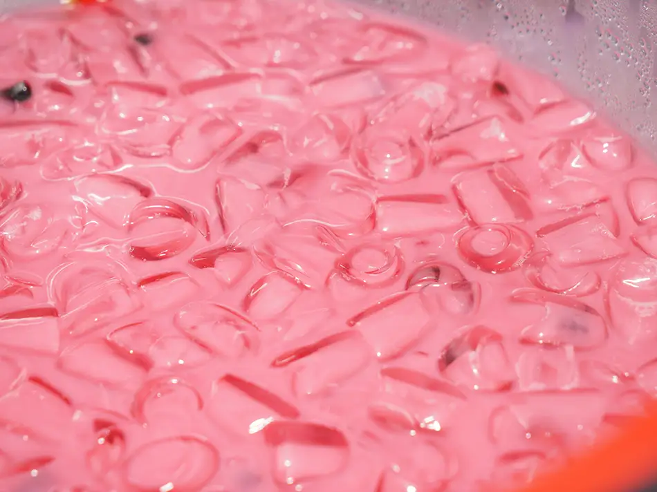 Sirap bandung rose syrup milk drink over ice.