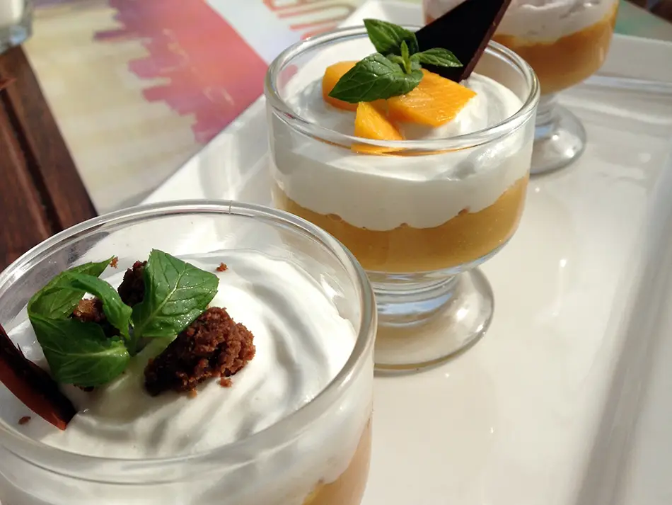 Suspiro a la Limeña in a glass with manjar crema and port meringue, Lima dessert.