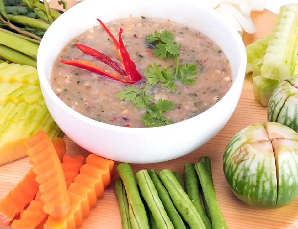 Tuk Kroeung, Cambodian herb and fish dipping sauce served with vegetables, a unique feature of Cambodian cuisine